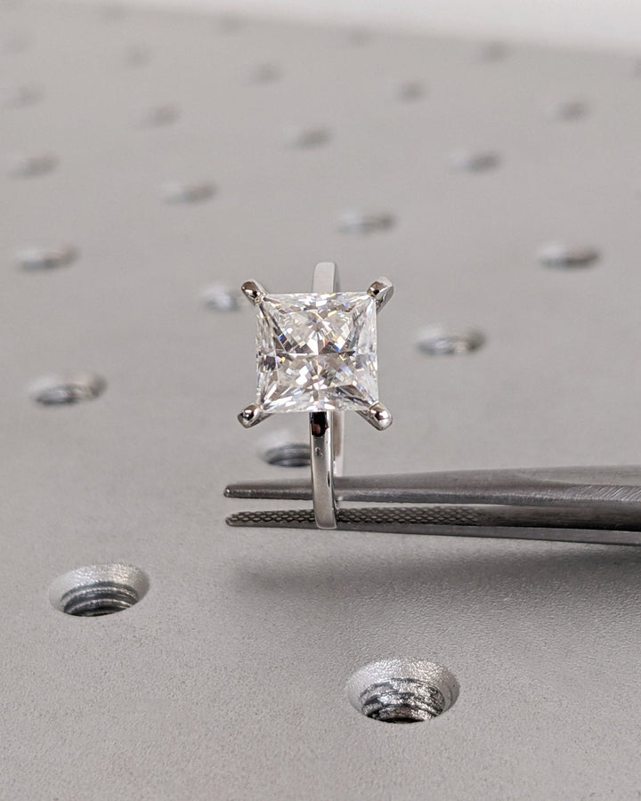 Princess solitaire engagement ring with IGI certificate and packaging