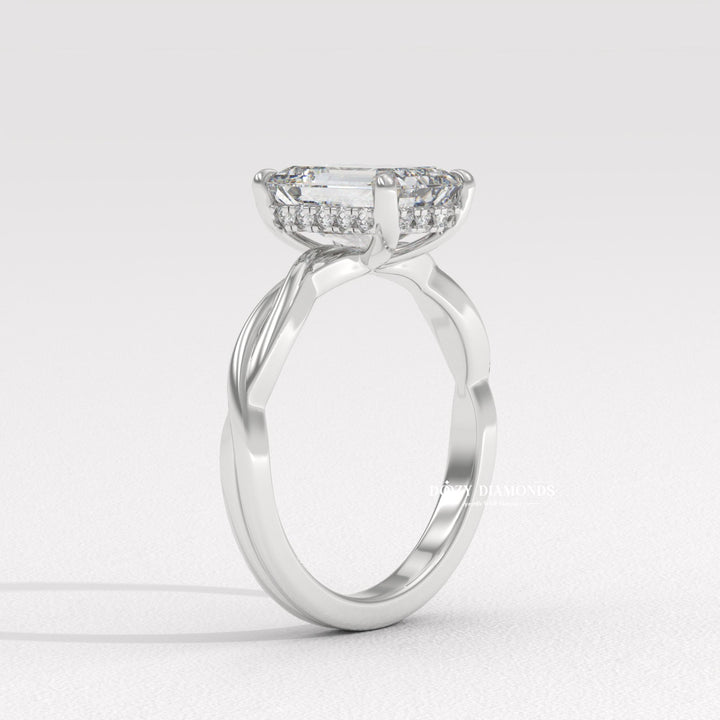 Emerald solitaire engagement ring finished in polished solid gold
