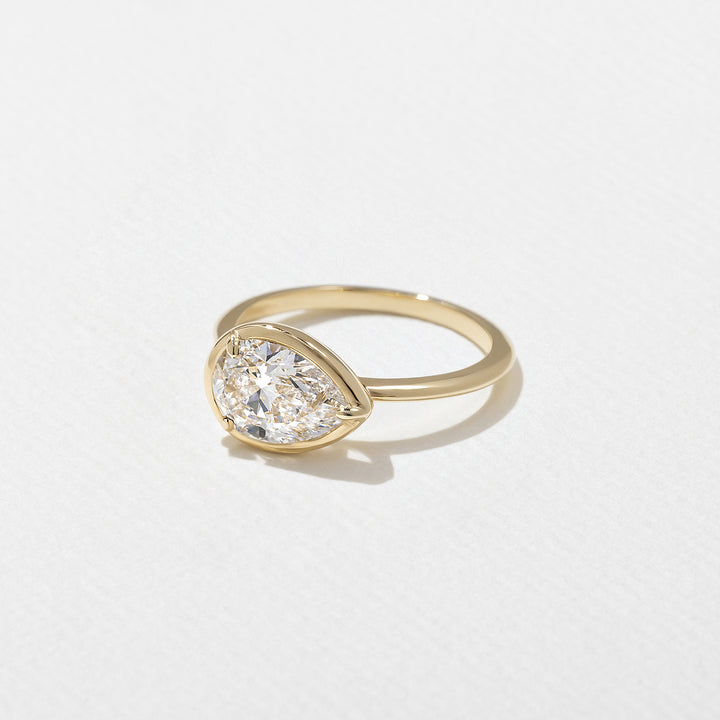1.0CT Bezel Set Pear E - VS Lab Grown Diamond Ring With Unique Curved Band - Doozy Diamonds