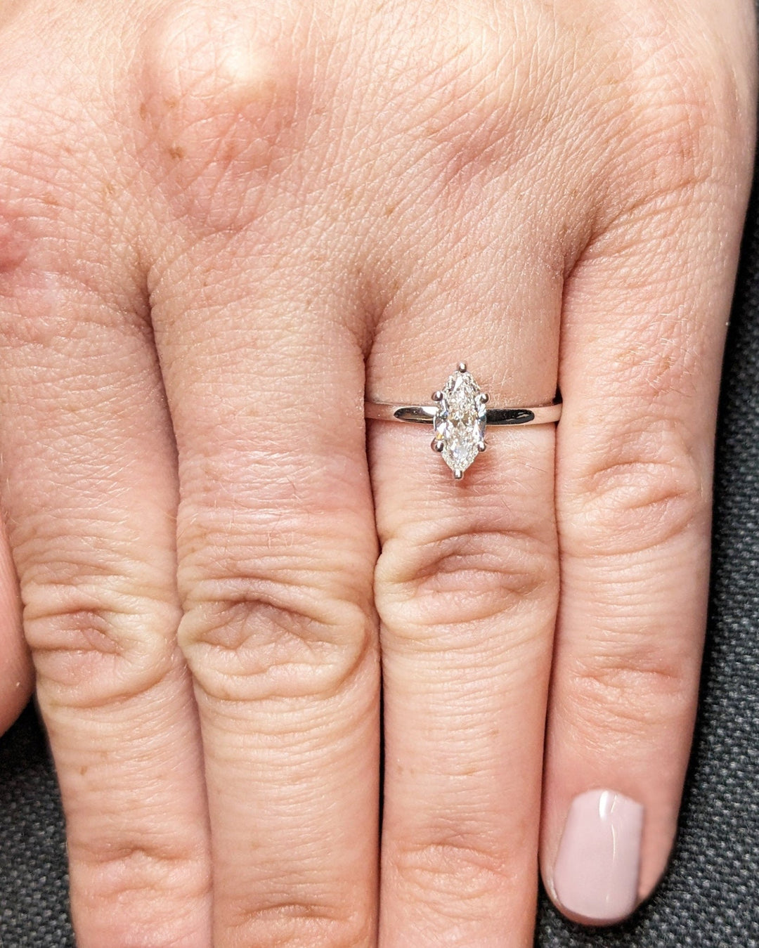 Marquise cut diamond ring worn on hand