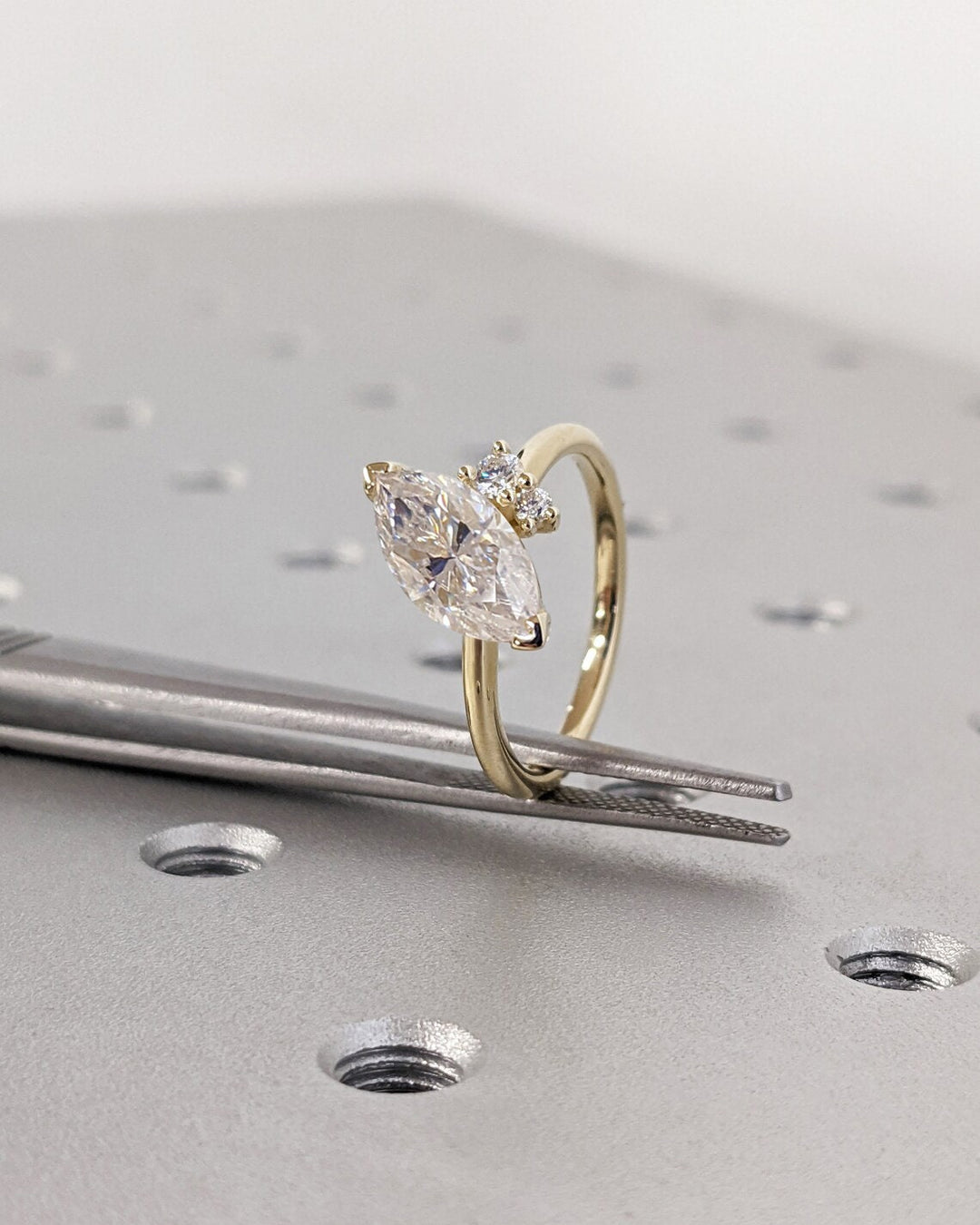 IGI certified marquise cut diamond in cluster engagement ring setting