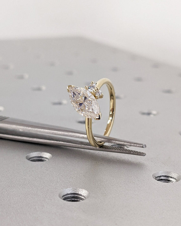 IGI certified marquise cut diamond in cluster engagement ring setting