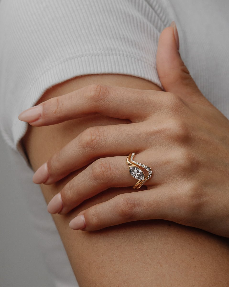 Fine craftsmanship detail on marquise solitaire engagement ring