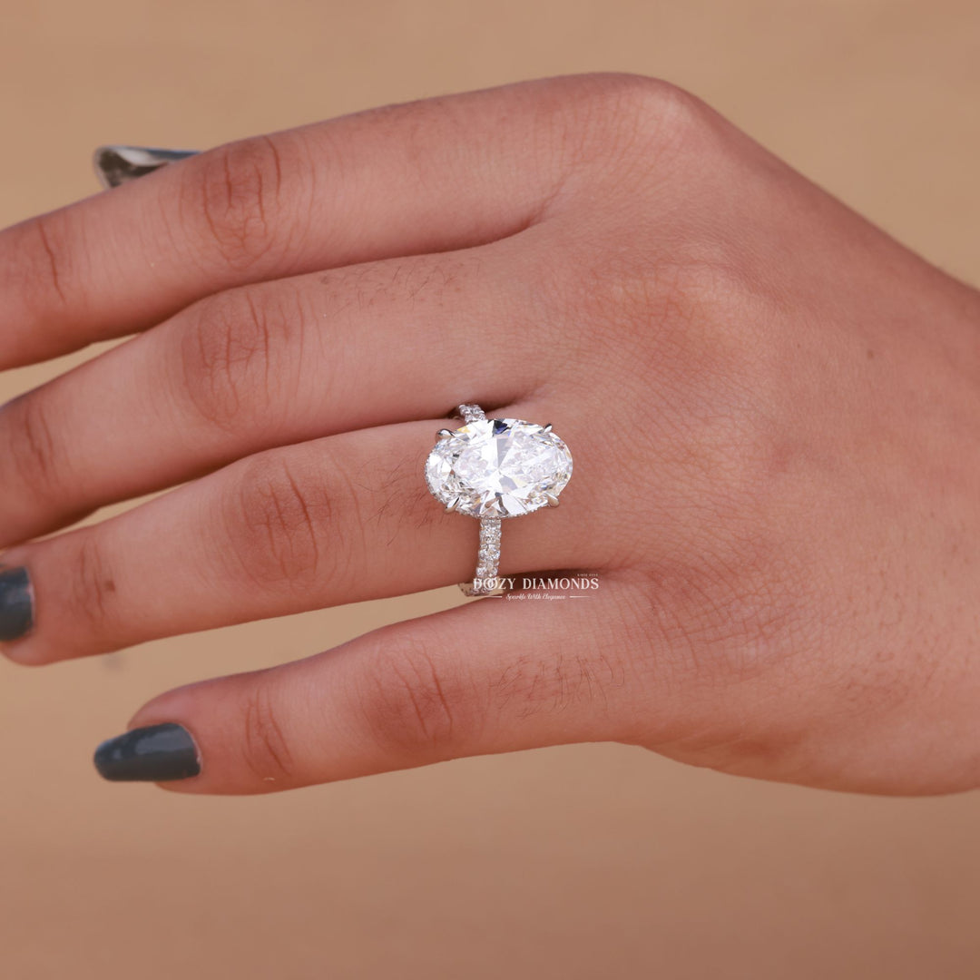Oval hidden halo diamond engagement ring available in multiple metals