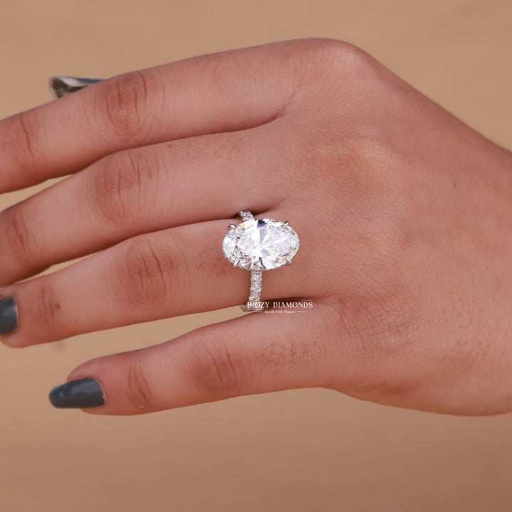 Oval hidden halo diamond engagement ring available in multiple metals