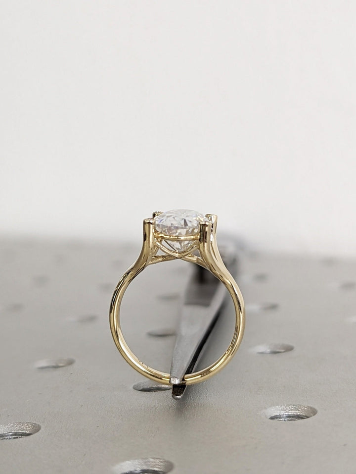 Fine craftsmanship detail on oval solitaire engagement ring