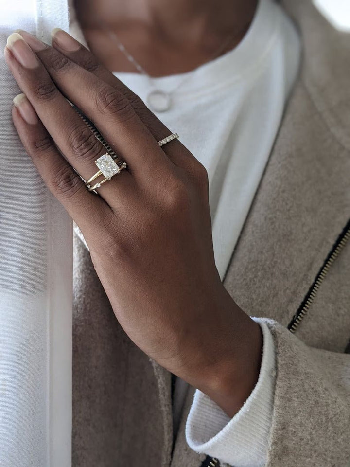 Radiant solitaire lab grown diamond ring side profile in gold setting