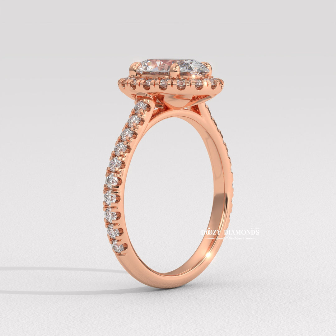 Oval halo lab grown diamond ring fitted on finger