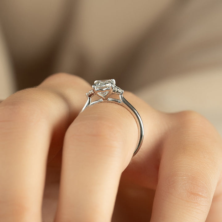 Emerald cut diamond ring worn on hand
