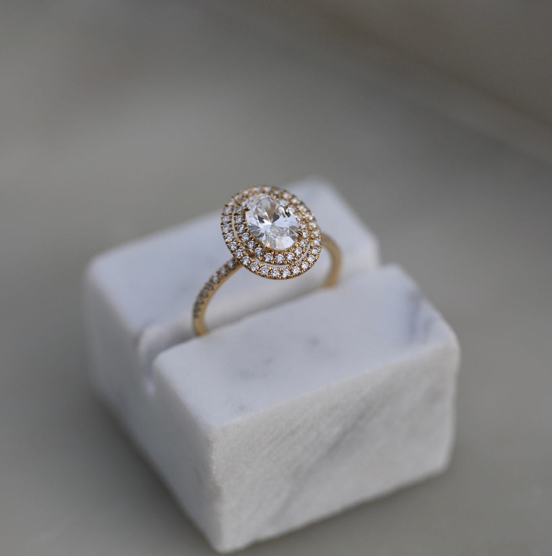Oval cut diamond ring worn on hand