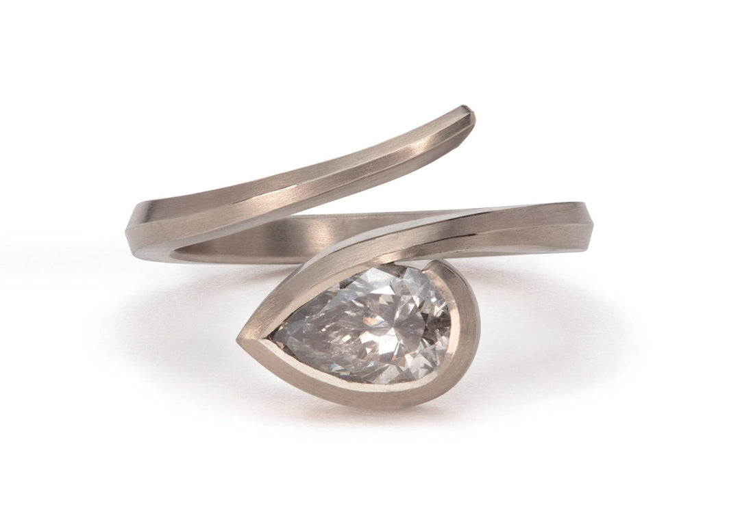 Pear cut solitaire engagement ring shown in real-life wear