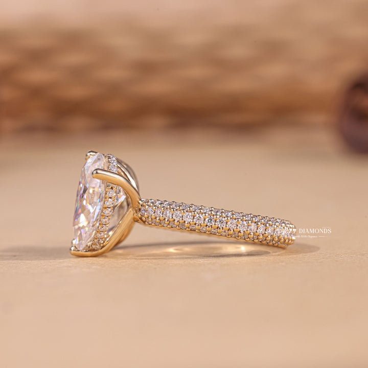 Top-down view of pear cut pave engagement ring