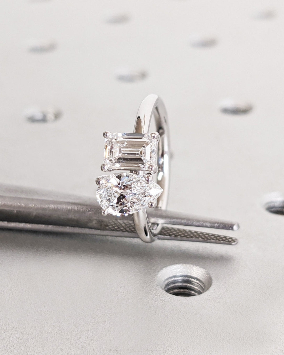 Pear cut engagement ring side view showing band detail