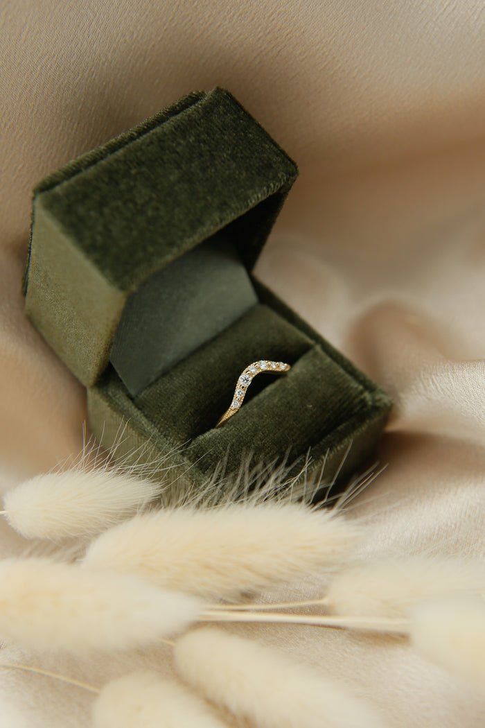 Round diamond band stacked with engagement ring