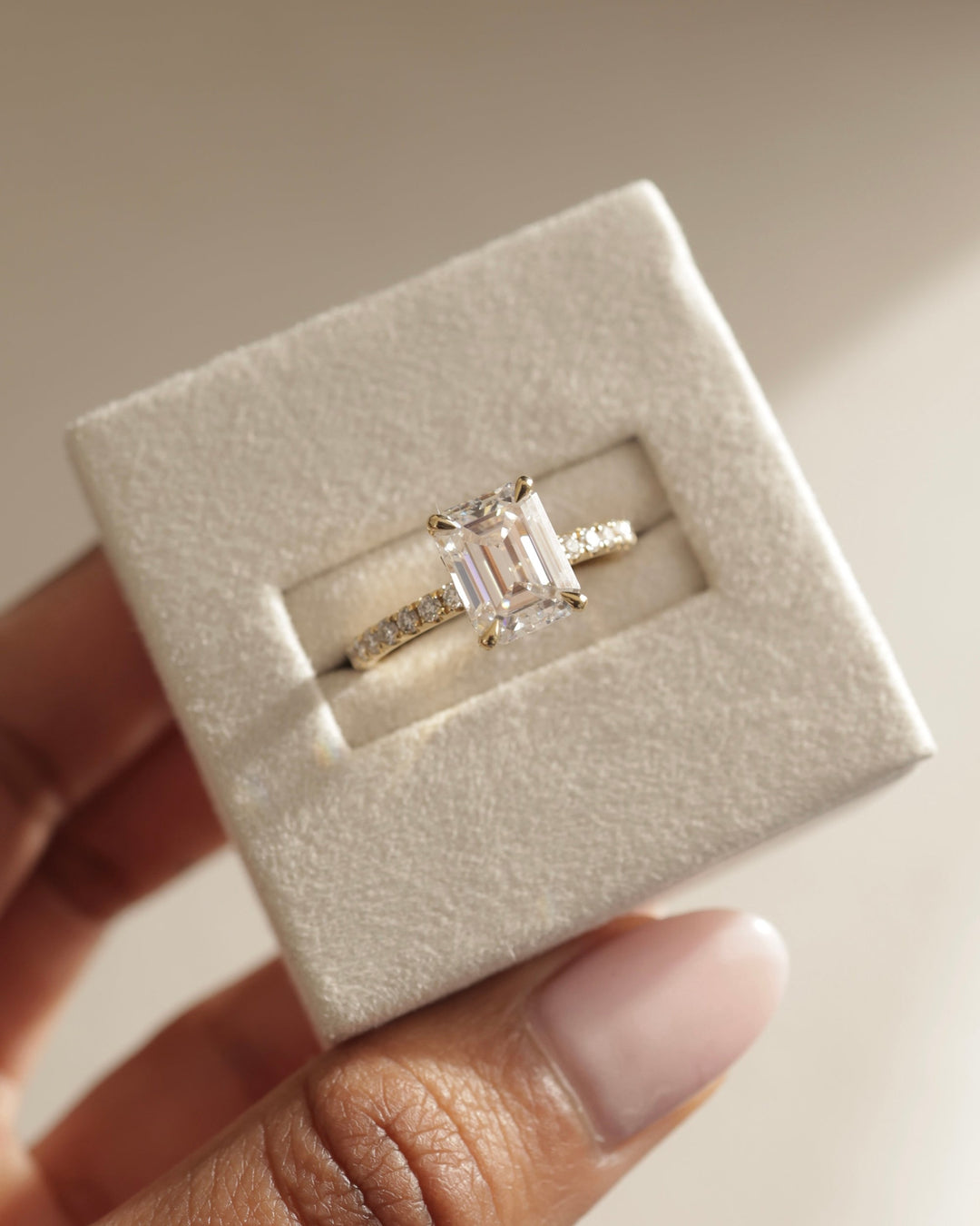 Emerald hidden halo lab grown diamond ring side profile in gold setting