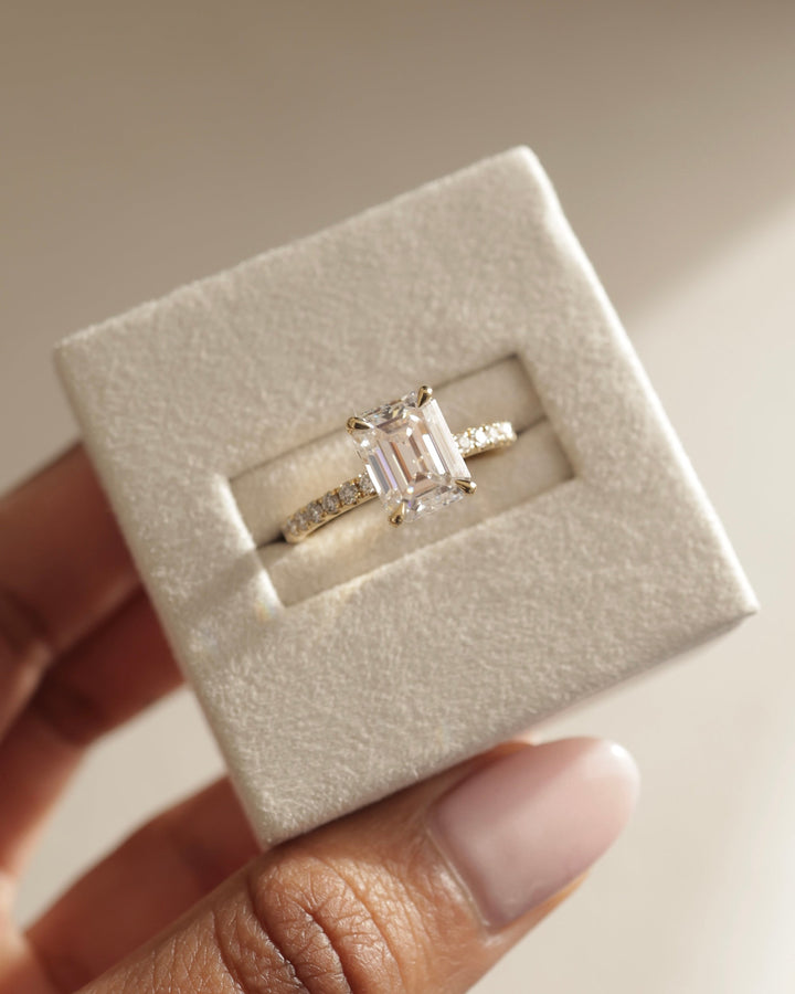 Emerald hidden halo lab grown diamond ring side profile in gold setting
