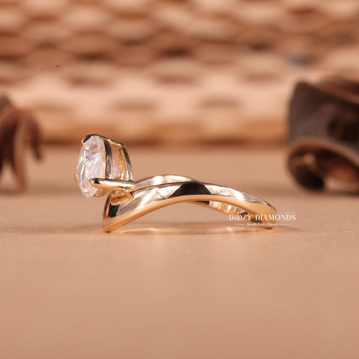 Side angle of pear east west diamond engagement ring