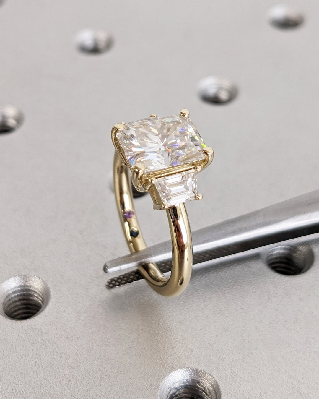 Radiant cut diamond ring worn on hand