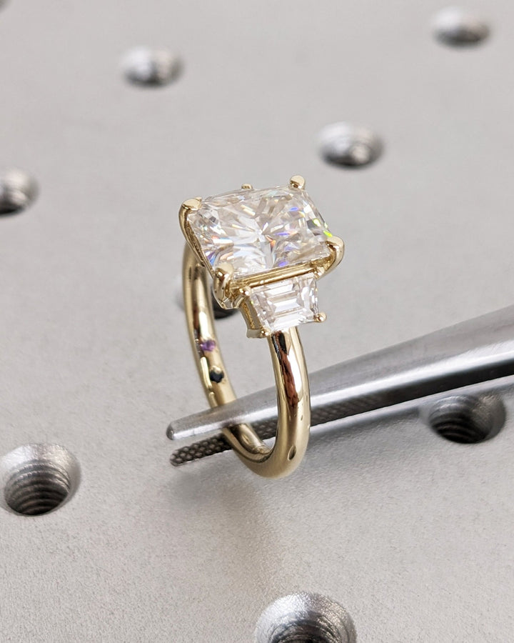 Radiant cut diamond ring worn on hand