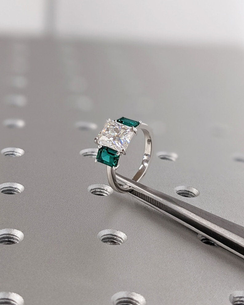 Radiant cut engagement ring shown with authenticity certificate