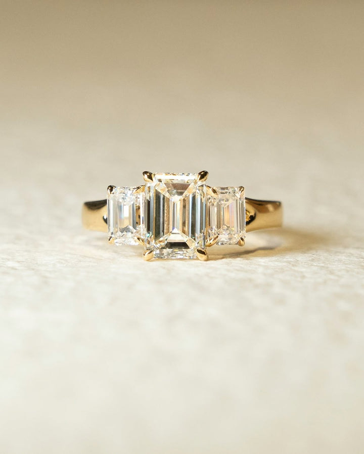 Emerald three stone lab grown diamond ring fitted on finger