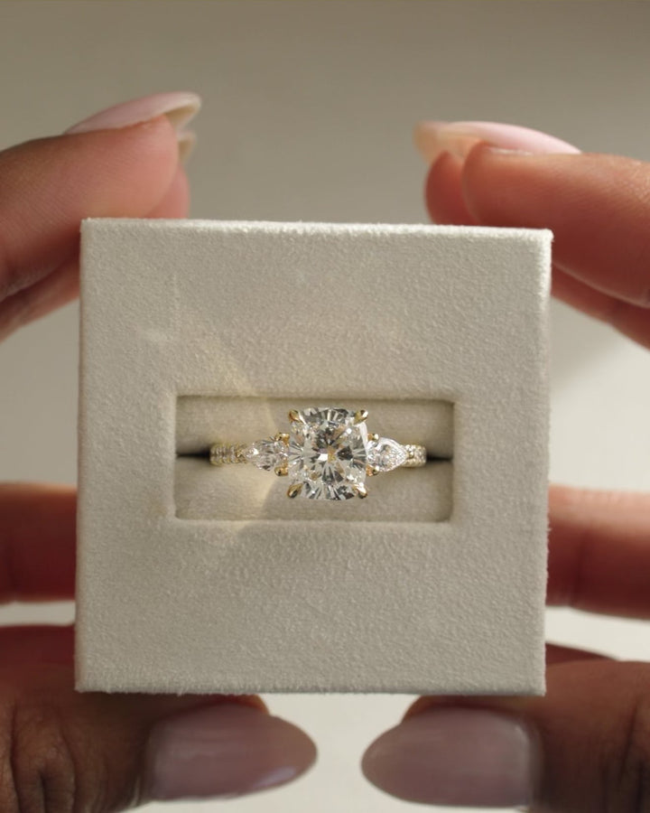 cushion three stone setting, elongated cushion setting, cushion pave setting, three stone engagement setting, pavé engagement setting, side stone pave setting, pavé band setting, full pavé band setting, half pavé band