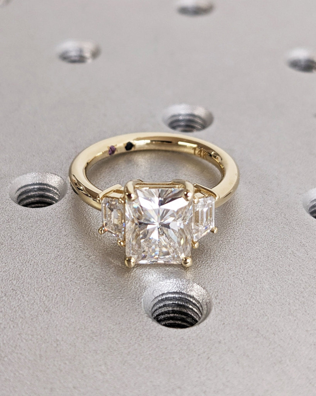 Profile view of radiant cut solitaire engagement ring band