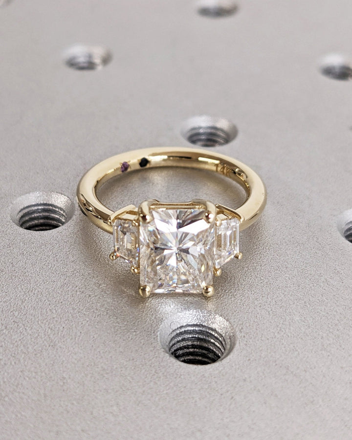 Profile view of radiant cut solitaire engagement ring band