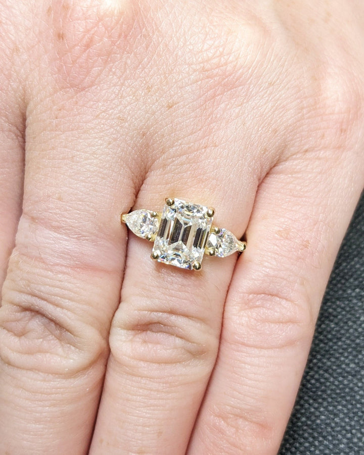Emerald cut engagement ring side view showing band detail