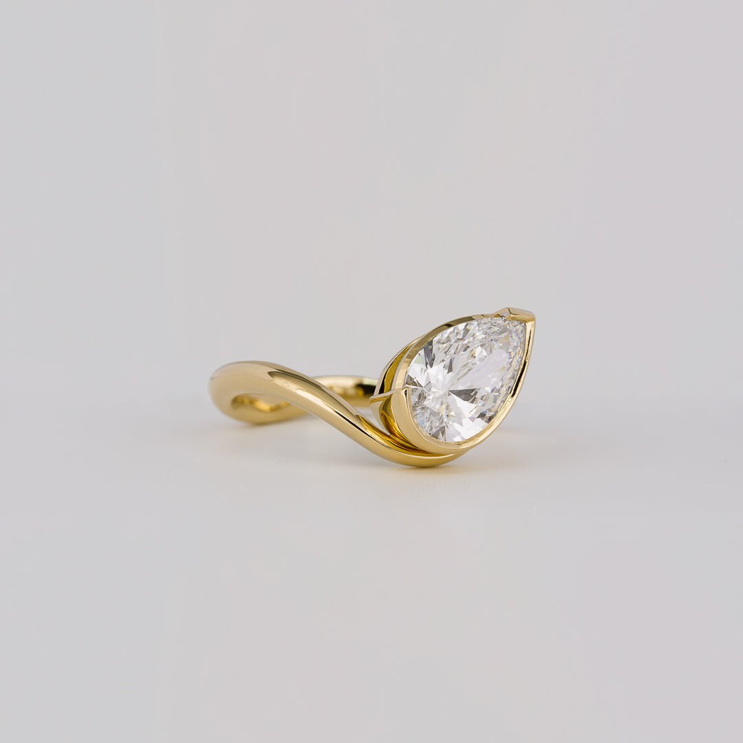 IGI certified pear cut diamond in solitaire engagement ring setting