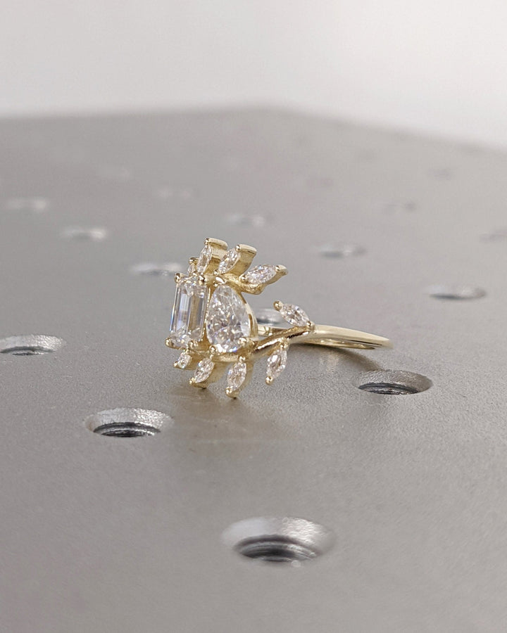 Pear cluster ring set with an IGI graded diamond