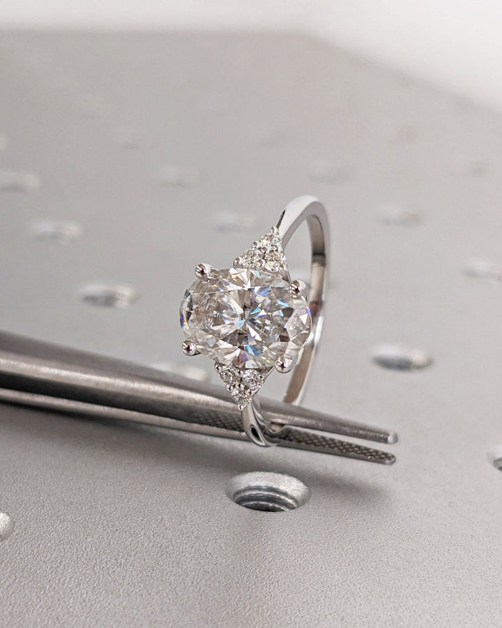 Side angle of oval cluster diamond engagement ring