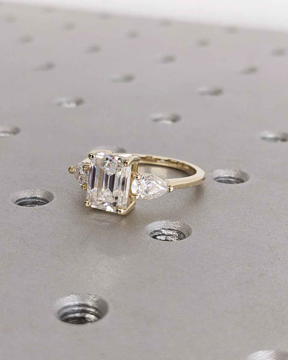 Emerald solitaire engagement ring close-up showing high clarity diamond clarity