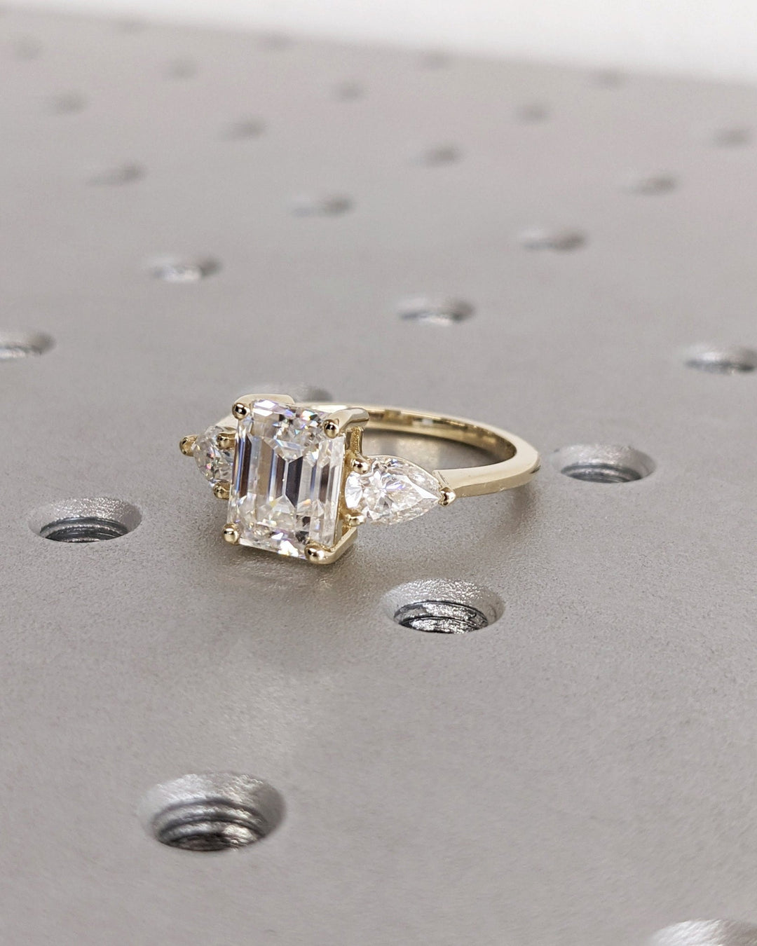 Emerald solitaire engagement ring close-up showing high clarity diamond clarity