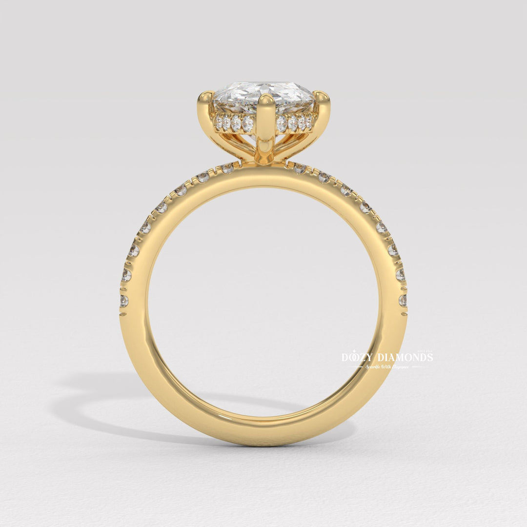 Pear solitaire diamond ring displayed on jewelry stand
