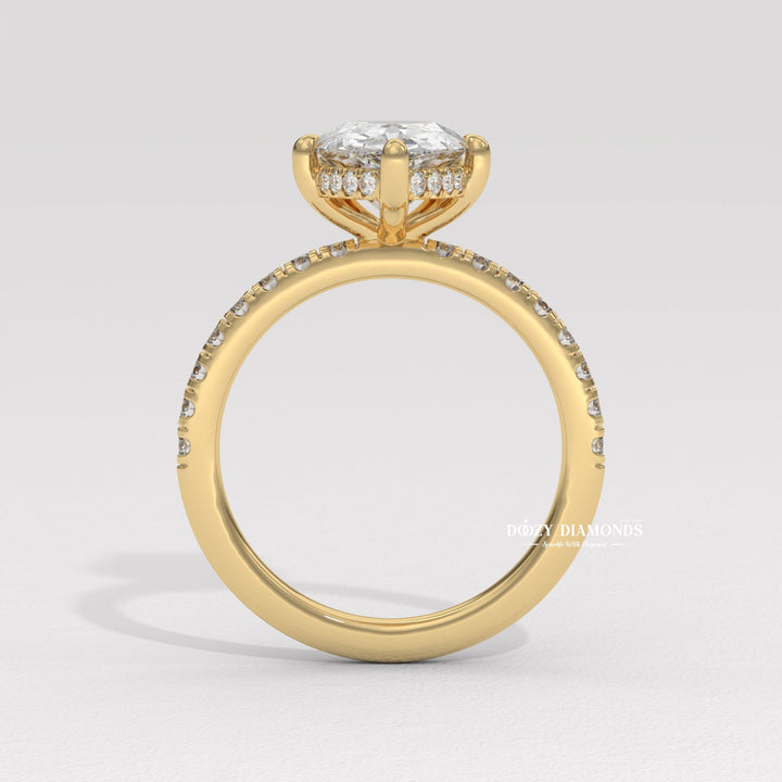 Pear solitaire diamond ring displayed on jewelry stand