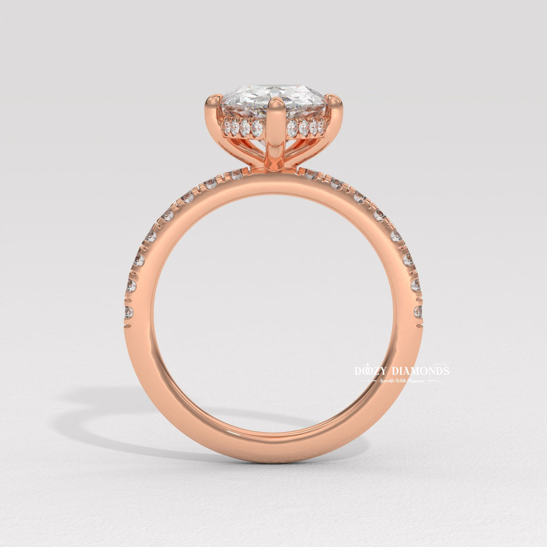 Pear solitaire engagement ring close-up highlighting diamond sparkle