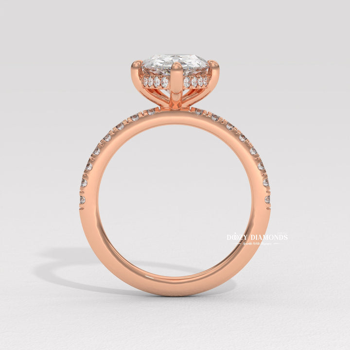 Pear solitaire engagement ring close-up highlighting diamond sparkle