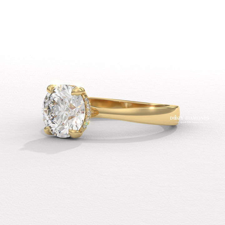 Diamond solitaire diamond ring displayed on jewelry stand