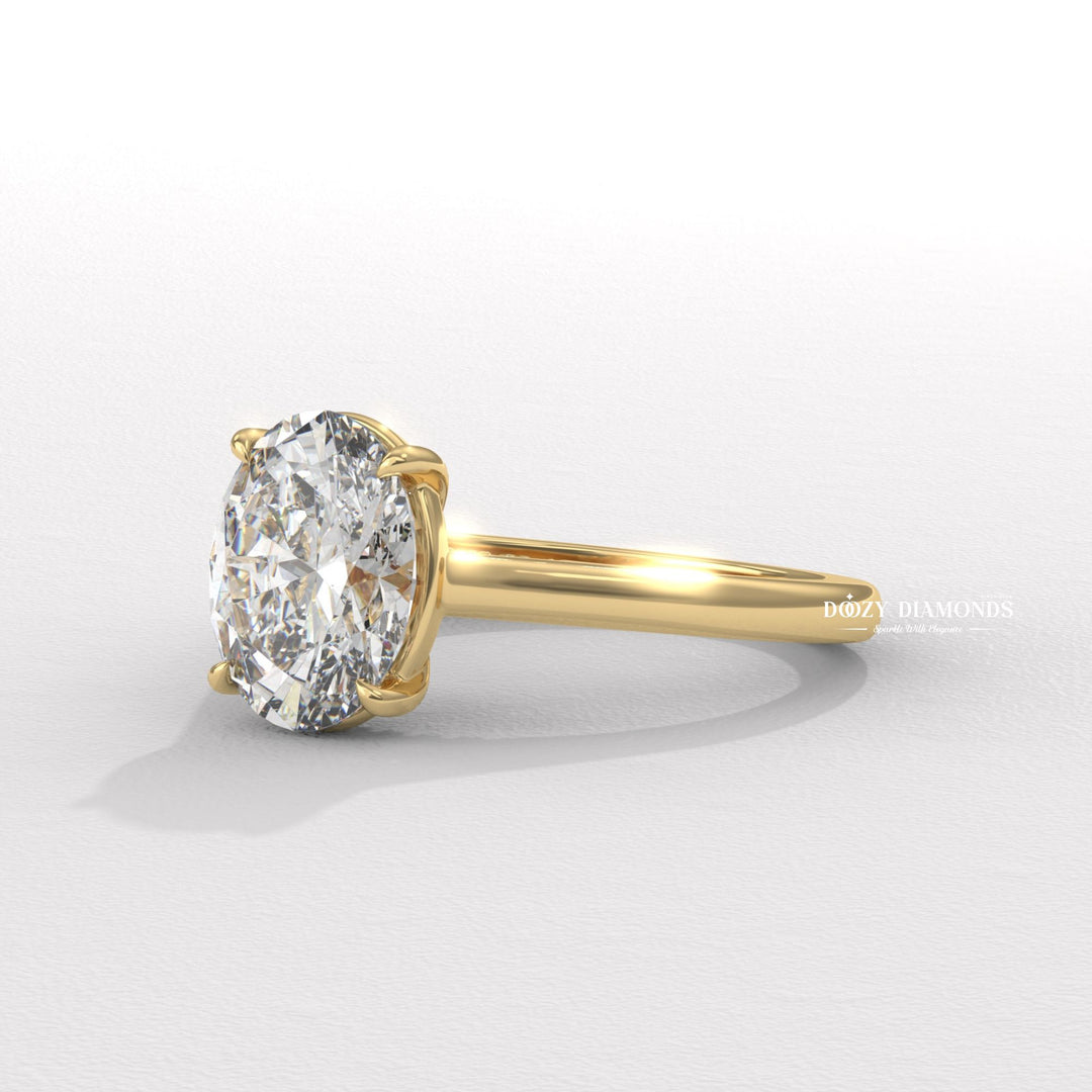 Oval solitaire diamond ring displayed on jewelry stand