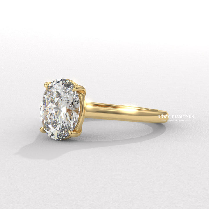 Oval solitaire diamond ring displayed on jewelry stand