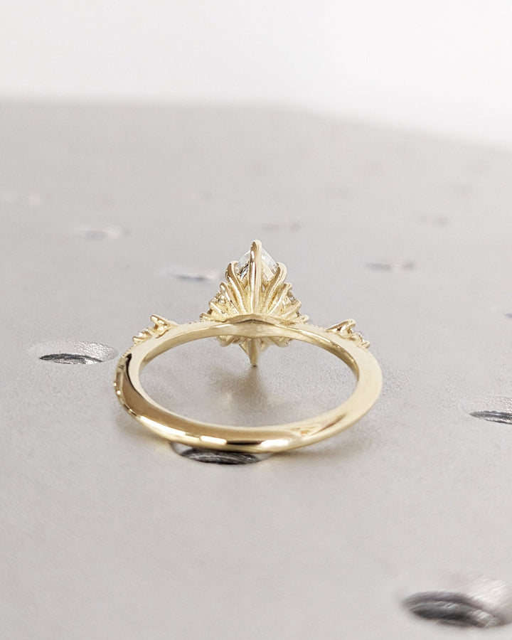 Side angle of marquise cluster diamond engagement ring