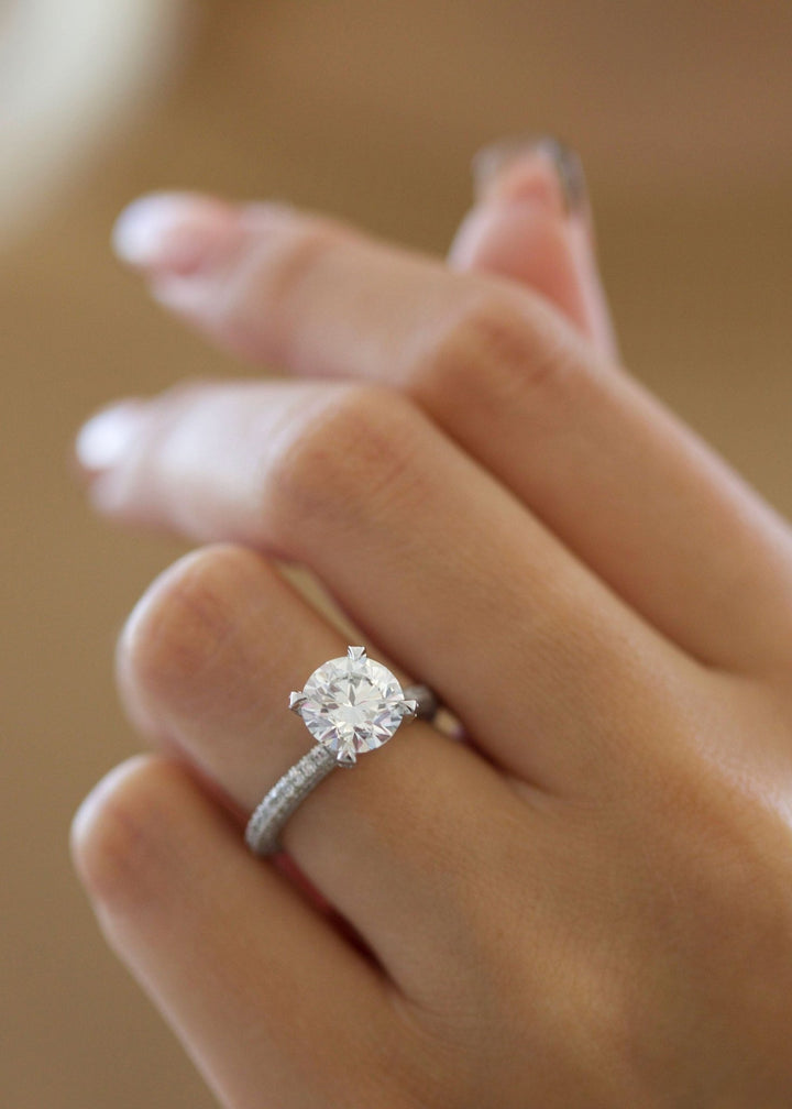 IGI certified round cut diamond in pave engagement ring setting