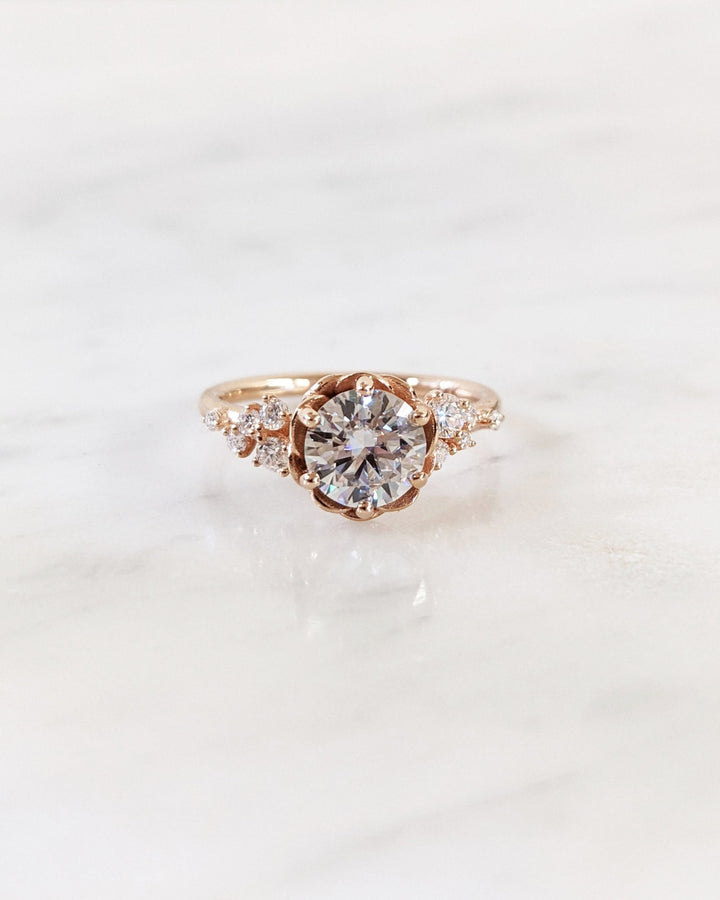 Profile view of round cut cluster engagement ring band