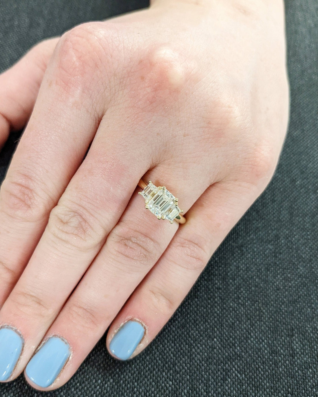 Emerald solitaire engagement ring close-up showing high clarity diamond clarity