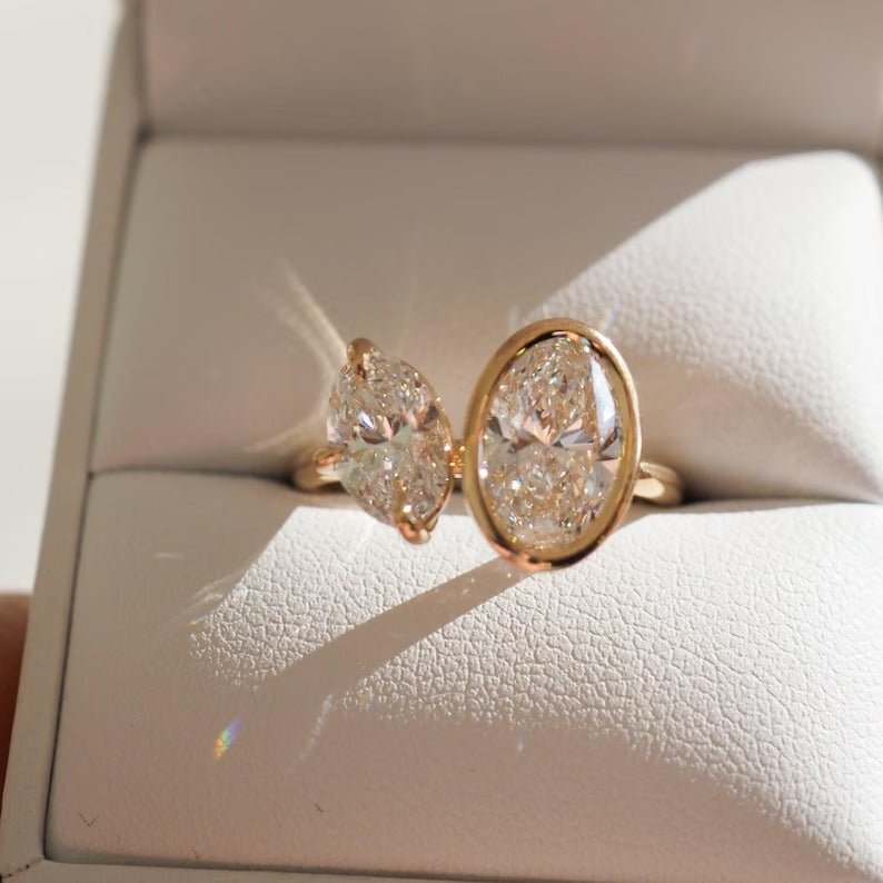 Oval bezel engagement ring viewed from the side