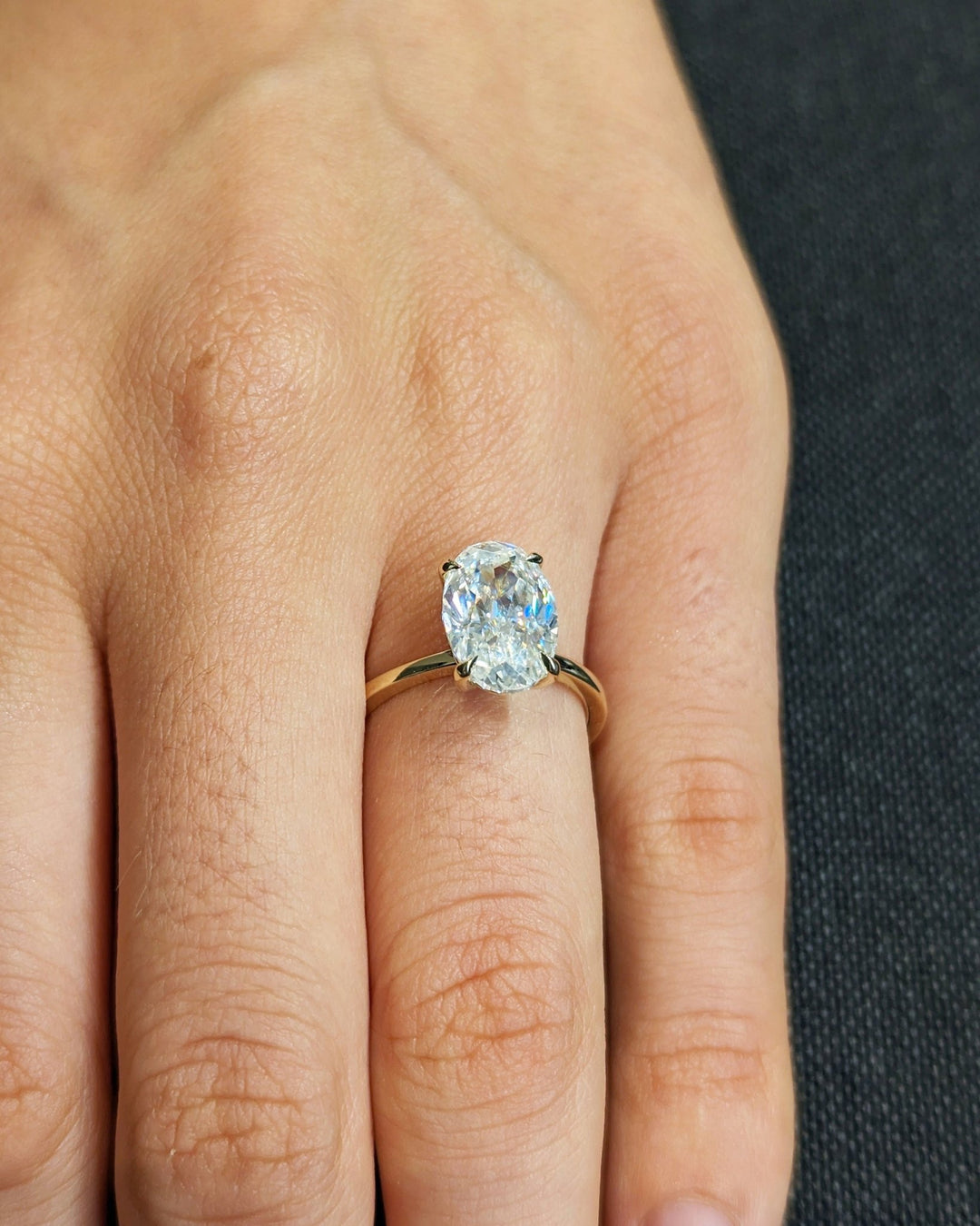 Profile view of oval cut solitaire engagement ring band
