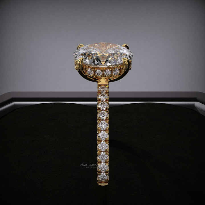 Profile view of oval cut hidden halo engagement ring band