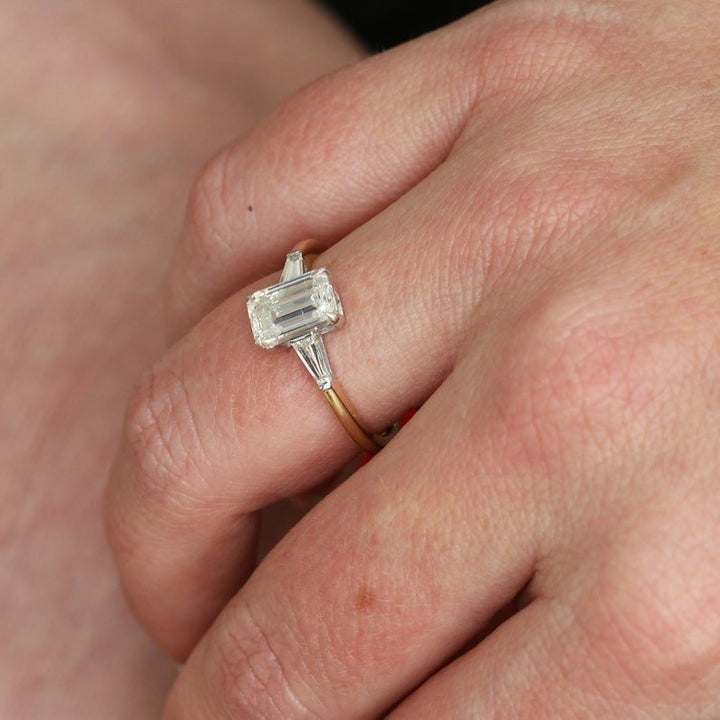 Emerald three stone engagement ring with certified lab grown diamond