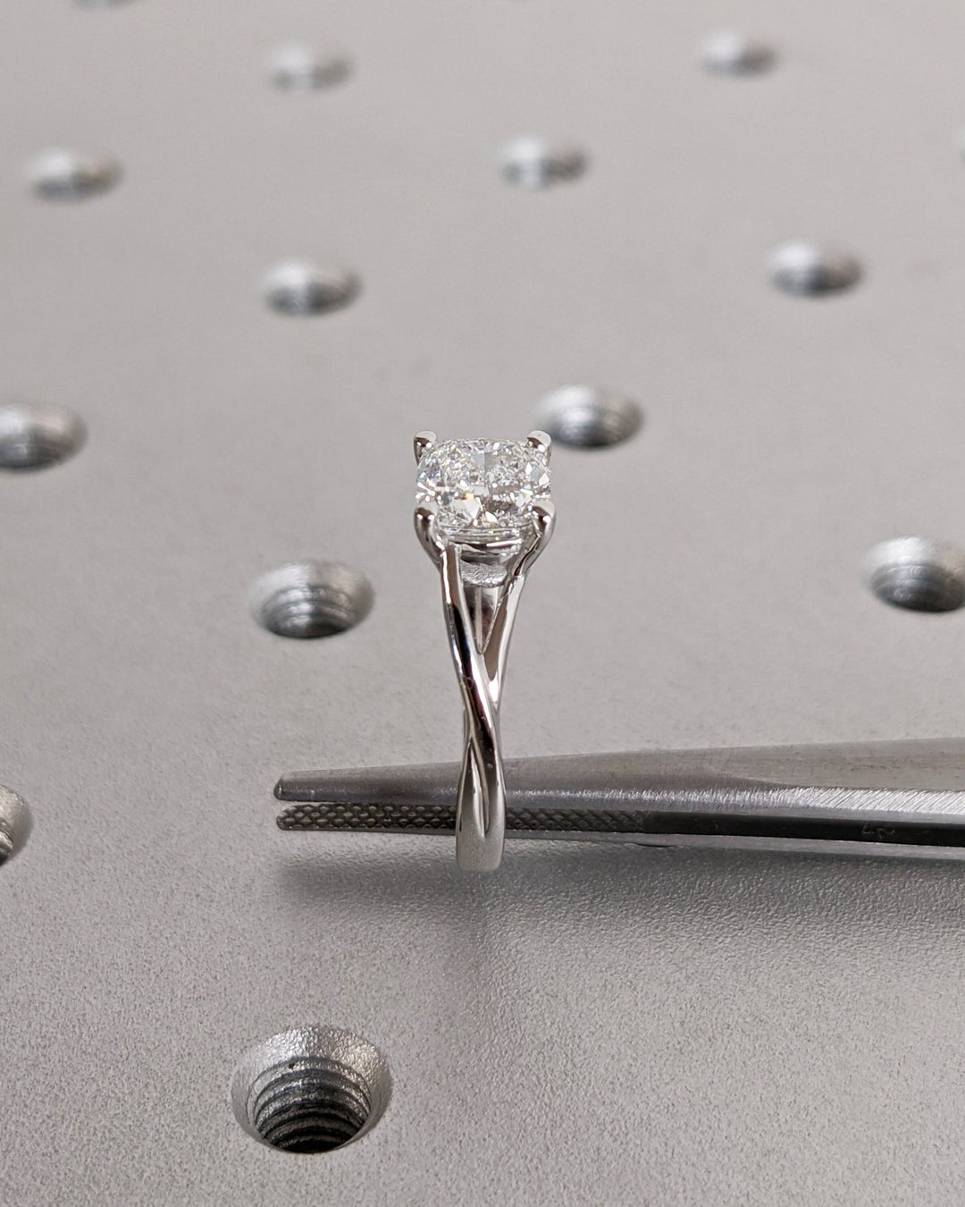 Lifestyle shot of cushion split shank diamond ring on hand